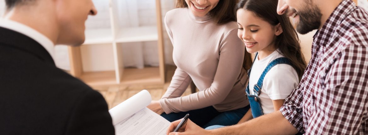 Young family signs associate agreement to buy house
